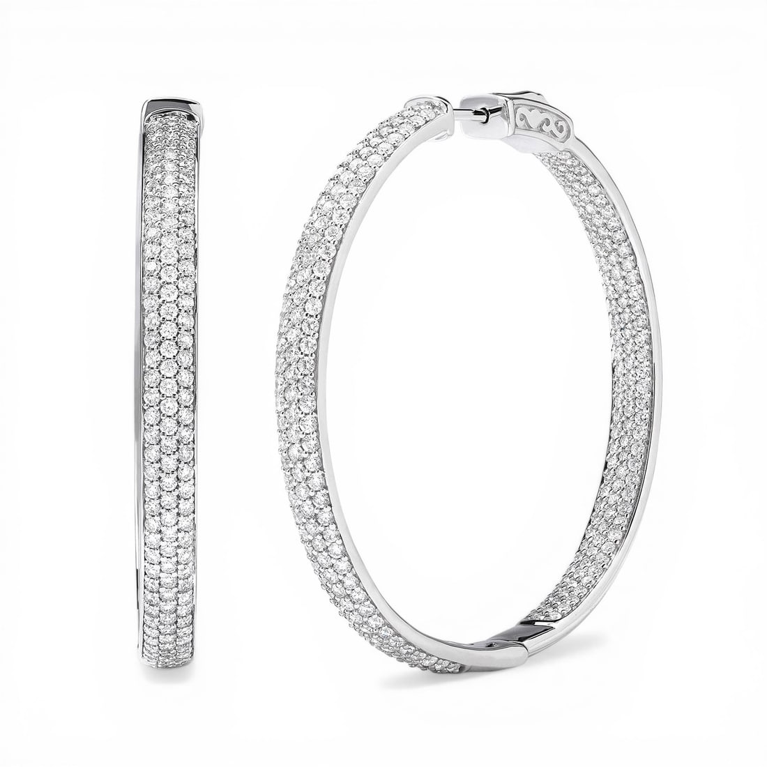 Duchess 4.03 ctw Diamond 18k White Gold Hoop Earrings: Retail Value: $29,130 Rare and radiant, this magnificent 3-Row pair of earrings featuring White Diamond offers a touch of the extraordinary. Securely held in a classic Micro-Pave design, the earrings 
