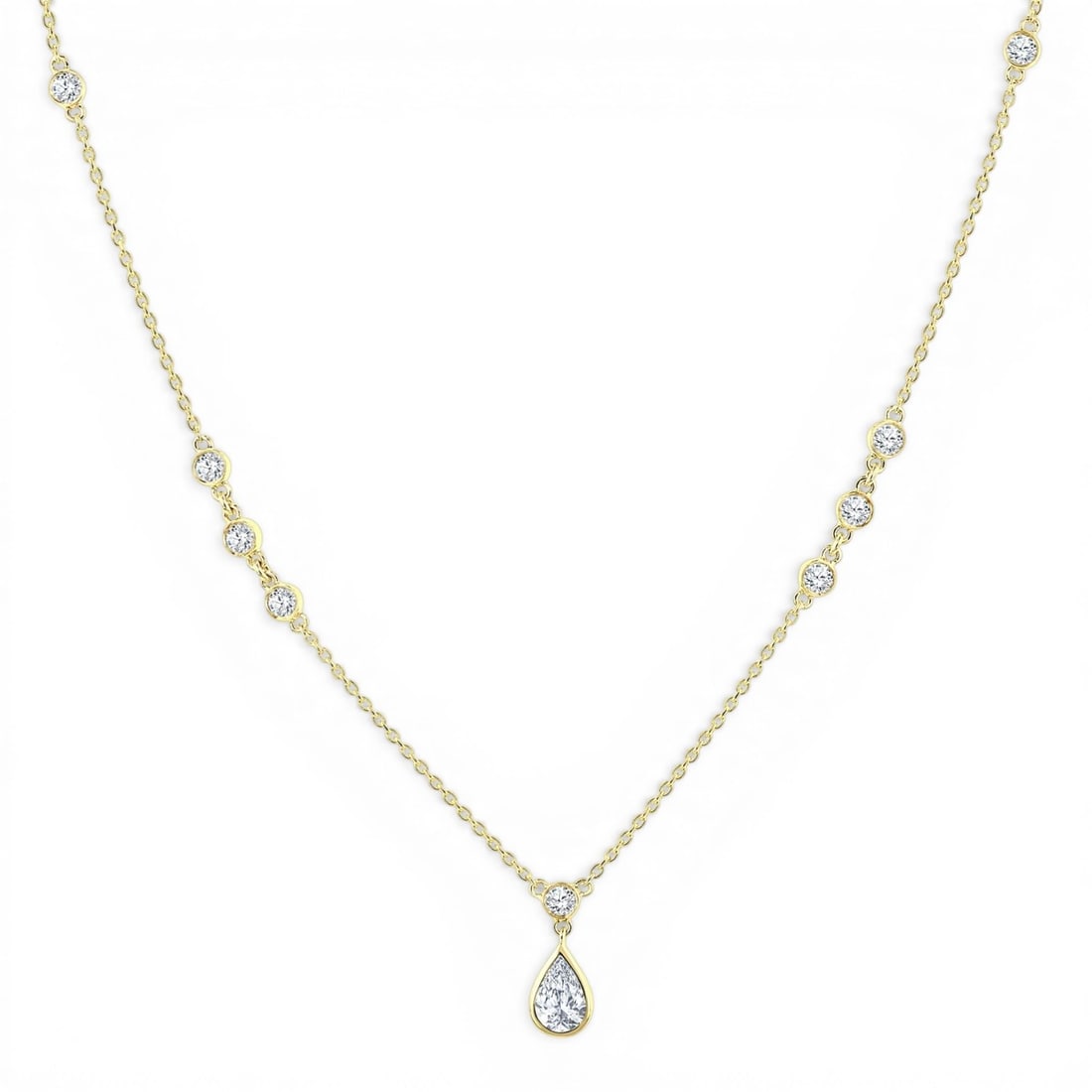 0.57 ctw Pear & Round Diamond Bezel Drop 14K Yellow Gold Necklace: Epitomizing grandeur, this elegant Bezel Drop necklace featuring White Diamond stands as a beacon of refined taste. Showcasing the gems in a Station/Drop Pendant arrangement, the necklace consists of 