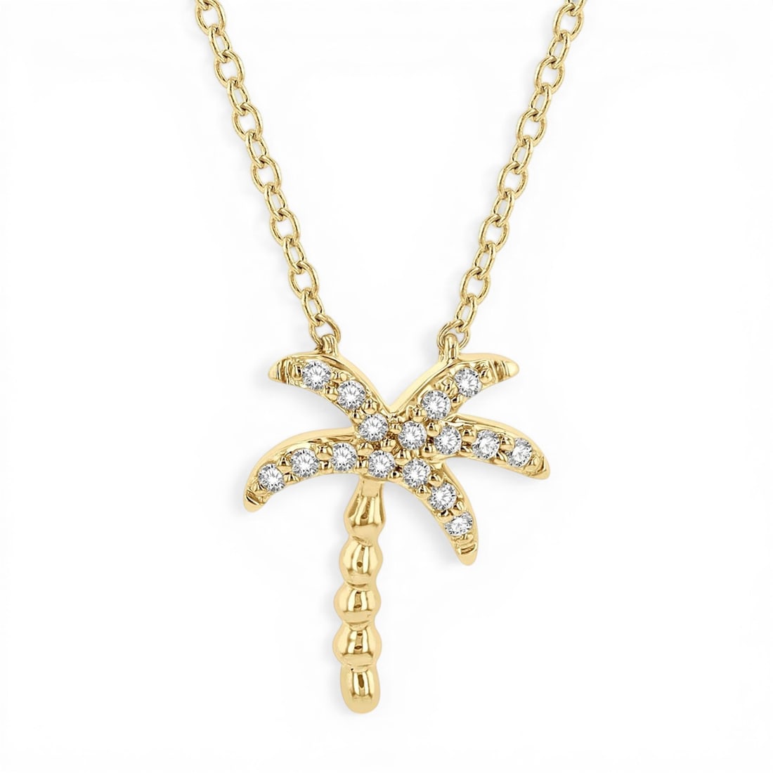 0.10 ctw Diamond Palm Tree Pendant Necklace 14K Yellow Gold: Rare and radiant, this elegant Palm Tree pendant necklace featuring Natural Diamonds offers a touch of the extraordinary. Crafted with precision, the Cluster setting is seamlessly integrated into 0.9 