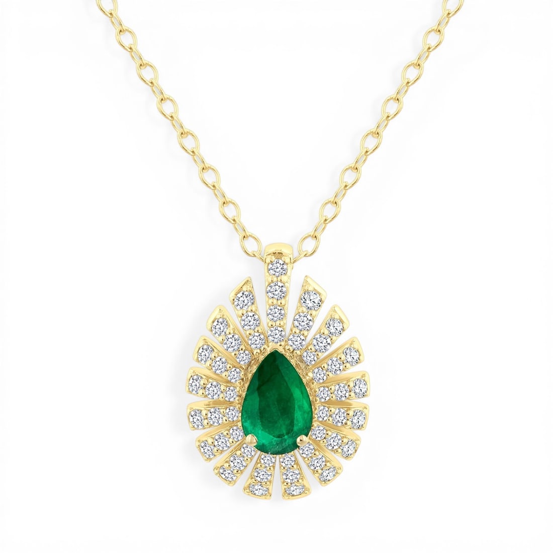 6x4mm Pear Emerald and 0.29 ctw Diamond Accent 14K Yellow Gold Pendant: Timeless and sophisticated, this elegant Starburst Halo pendant featuring Emerald, White Diamond radiates enduring beauty. Securely held in a classic Starburst Halo design, the pendant is forged from 
