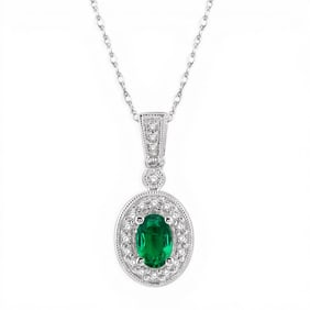 6x4mm Oval Emerald and 0.12 ctw Diamond 14K White Gold Pendant