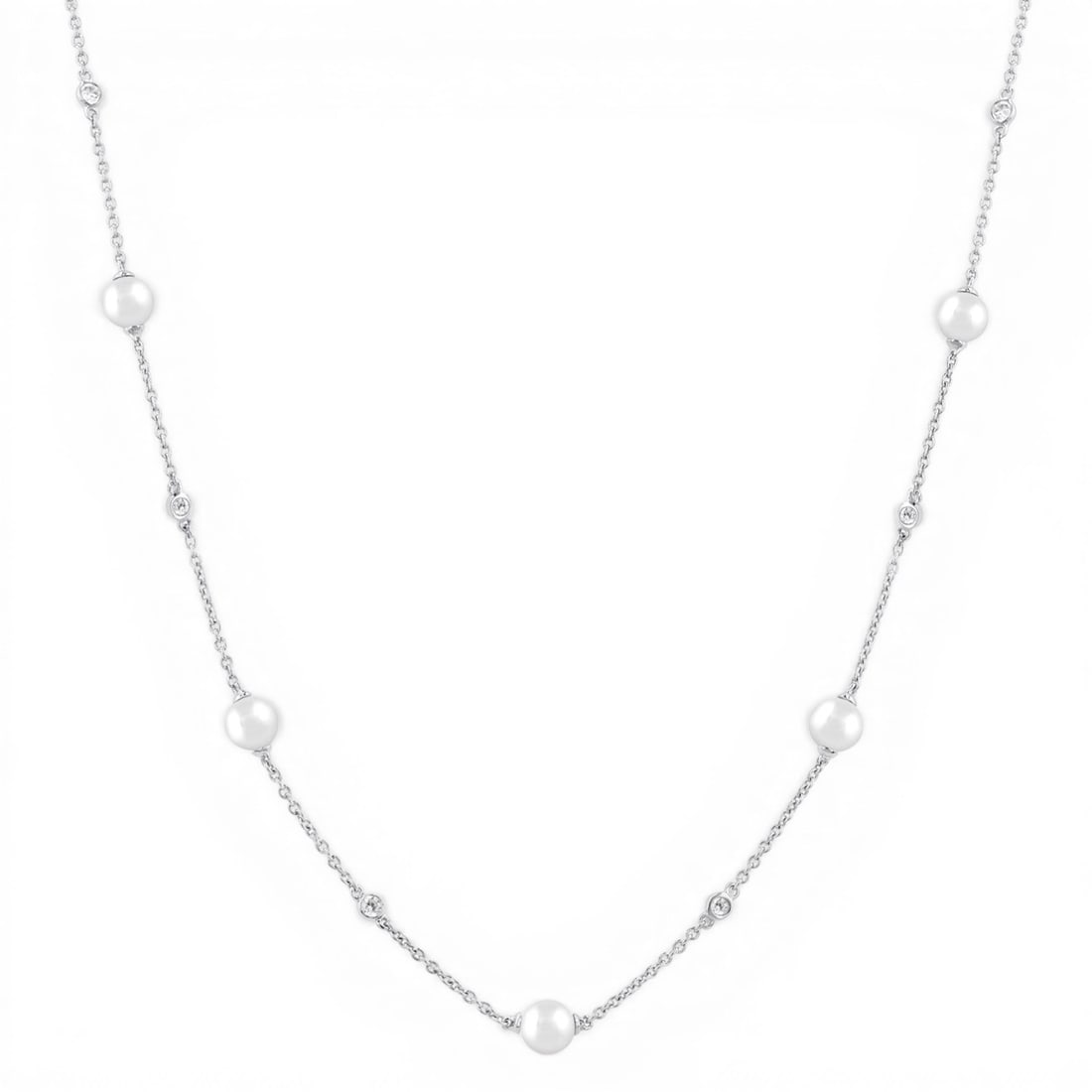 4mm Cultured Pearl and 0.15 ctw Diamond 14K White Gold Necklace: An exquisite masterpiece of haute joaillerie, this stunning Station necklace featuring Cultured Pearl, White Diamond is a true treasure. A detailed Station gallery secures the stones, rendered in 1.85