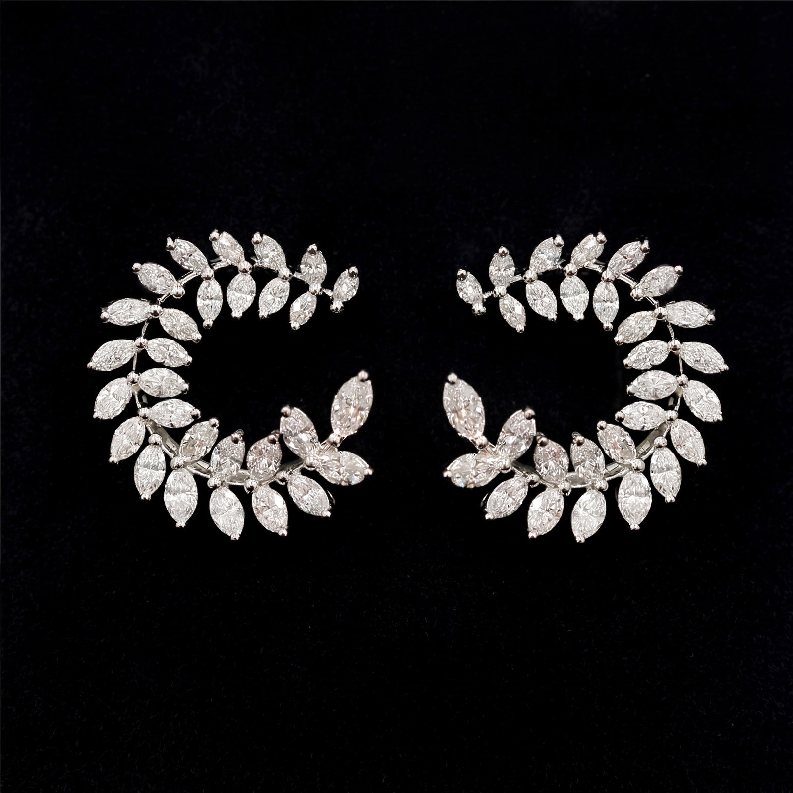 2.25 ctw White Diamond Leaf Design Platinum Earrings: Retail Value: $11,190 An exquisite masterpiece of haute joaillerie, this stunning Leaf Design pair of earrings featuring White Diamond is a true treasure. Showcasing the gems in a Cluster arrangement,