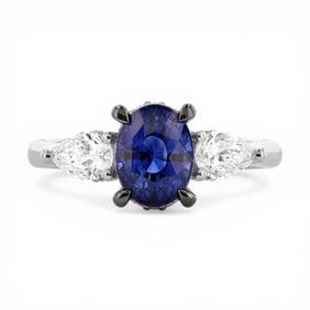 Blue Sapphire and 0.71 ctw Diamond Platinum Three-Stone Ring