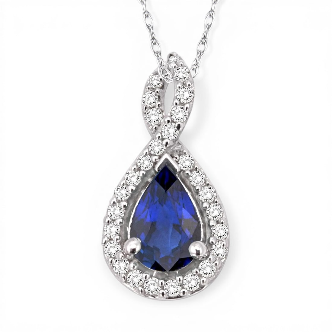 6x4mm Sapphire and 0.11 ctw Diamond 14K White Gold Pendant: A testament to superior craftsmanship, this elegant Halo pendant featuring Blue Sapphire, White Diamond is unparalleled. Crafted with precision, the Halo setting is seamlessly integrated into 0.85 gra