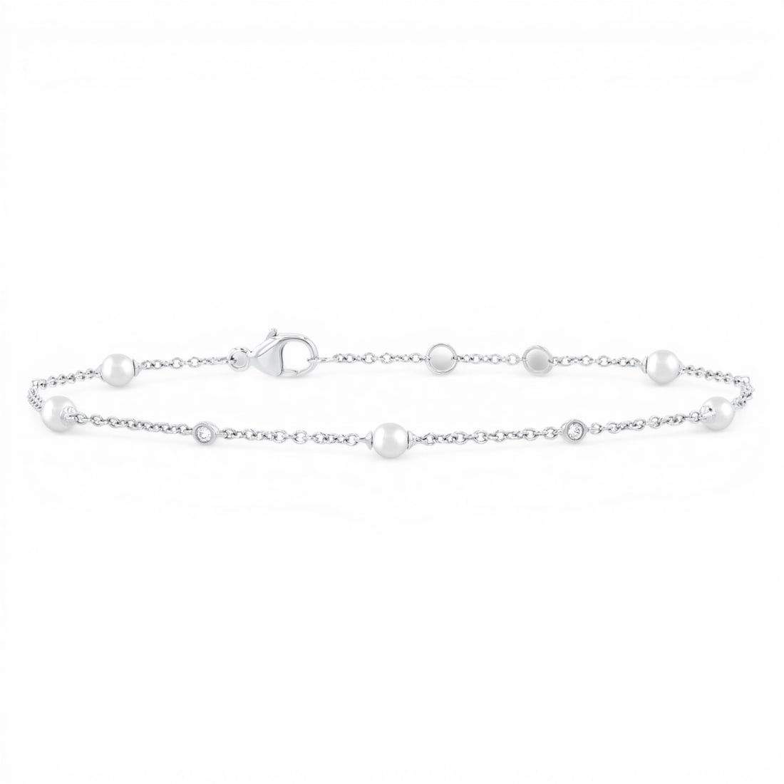 3mm Cultured Pearl and 0.07 ctw White Diamond 14K White Gold Bracelet: A symphony of light and color, this elegant Station bracelet featuring Cultured Pearl, White Diamond embodies the pinnacle of luxury. Expertly mounted in a Station setting, the bracelet is crafted in 