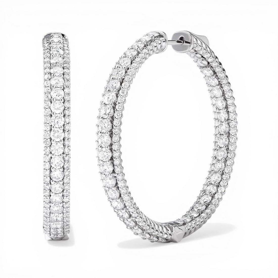 Duchess 6.23 ctw Diamond 18K White Gold Hoop Earrings: Retail Value: $29,235 An exquisite masterpiece of haute joaillerie, this magnificent Duchess 3-Row pair of earrings featuring White Diamond is a true treasure. The gemstones are nestled within a Tripl