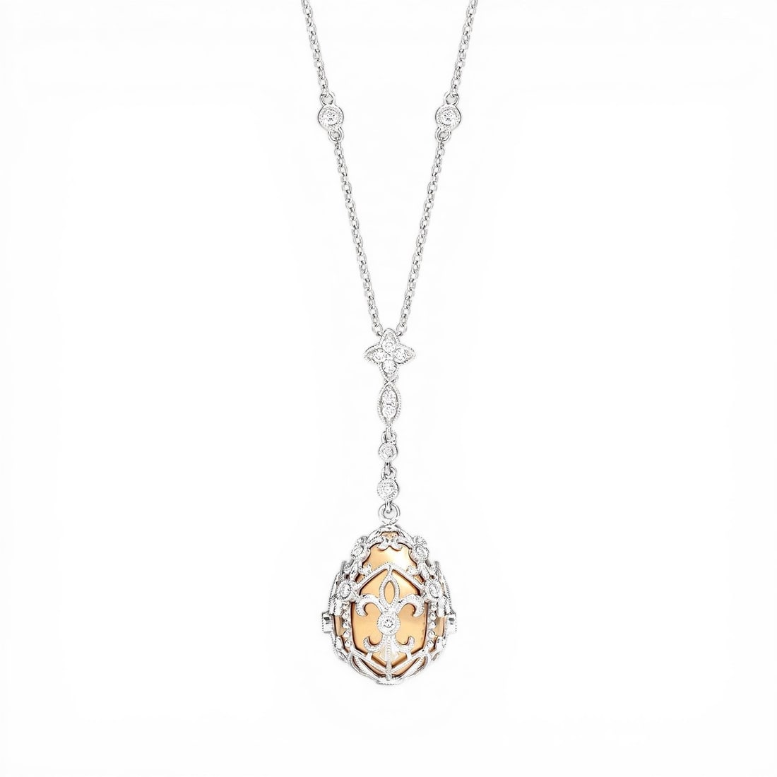 0.59 ctw Diamond 18K Yellow & White Gold Pendant: Captured in a moment of brilliance, this breathtaking Cage Drop necklace featuring Natural Diamonds speaks to the connoisseur. The gemstones are nestled within a Drop framework, supported by a substan