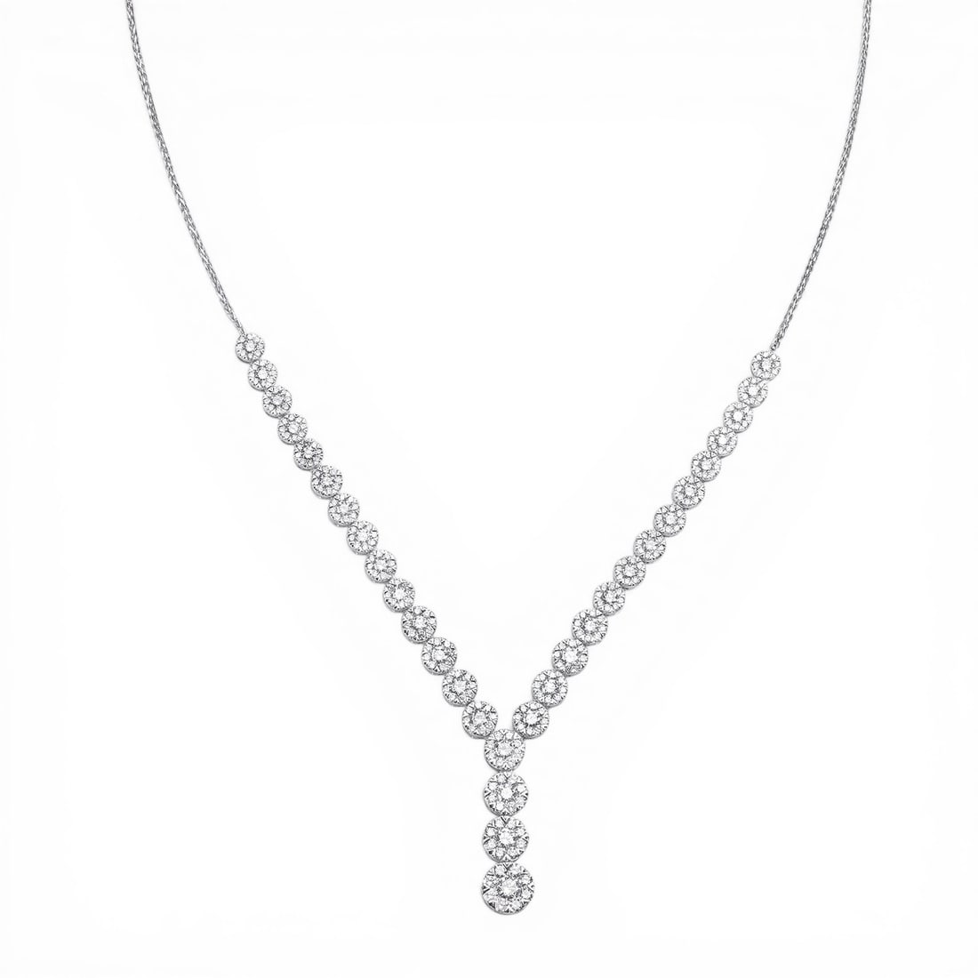 3.24 ctw White Diamond Cluster 18K White Gold Lariat Necklace: Rare and radiant, this magnificent Cluster necklace featuring White Diamond offers a touch of the extraordinary. Showcasing the gems in a Cluster arrangement, the necklace consists of 8.45 grams of 18