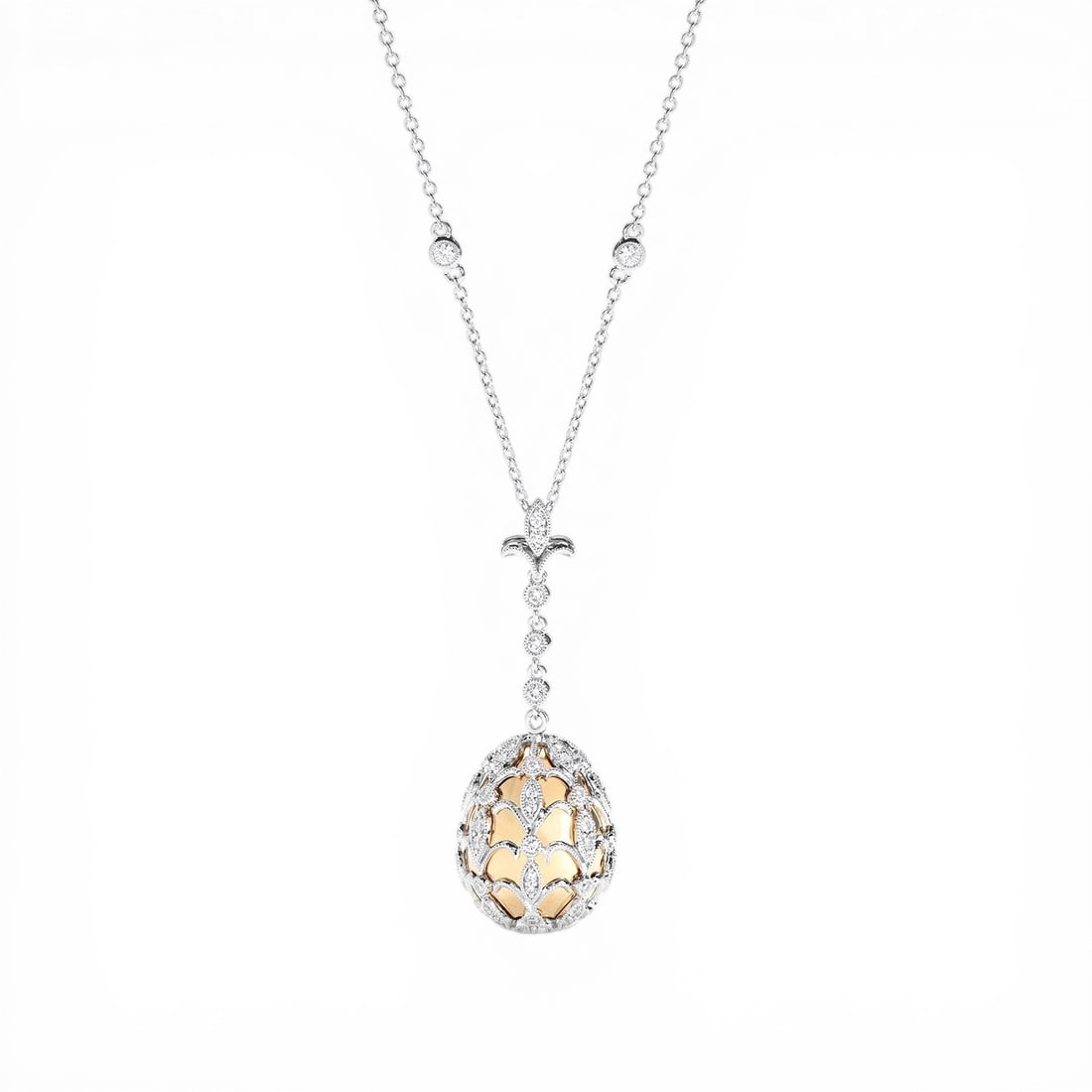 0.84 ctw Diamond 18K Yellow & White Gold Pendant: Epitomizing grandeur, this stunning Cage Drop necklace featuring Natural Diamonds stands as a beacon of refined taste. Showcasing the gems in a Drop Pendant arrangement, the necklace consists of 7.75 