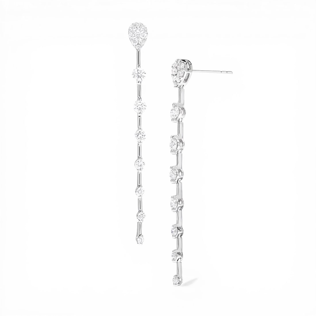0.90 ctw White Diamond Fiori Cluster Drop 18K White Gold Earrings: Epitomizing grandeur, this stunning Fiori Cluster Drop pair of earrings featuring White Diamond stands as a beacon of refined taste. Crafted with precision, the Cluster/Bar Link Drop setting is seamle