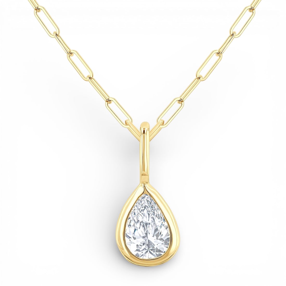 0.21 ctw Pear Cut White Diamond Bezel Set 14K Yellow Gold Pendant: Exuding opulence and grace, this elegant Bezel Set pendant featuring White Diamond is crafted for the distinguished. A detailed Bezel gallery secures the stones, rendered in 0.24 grams of lustrous 14K