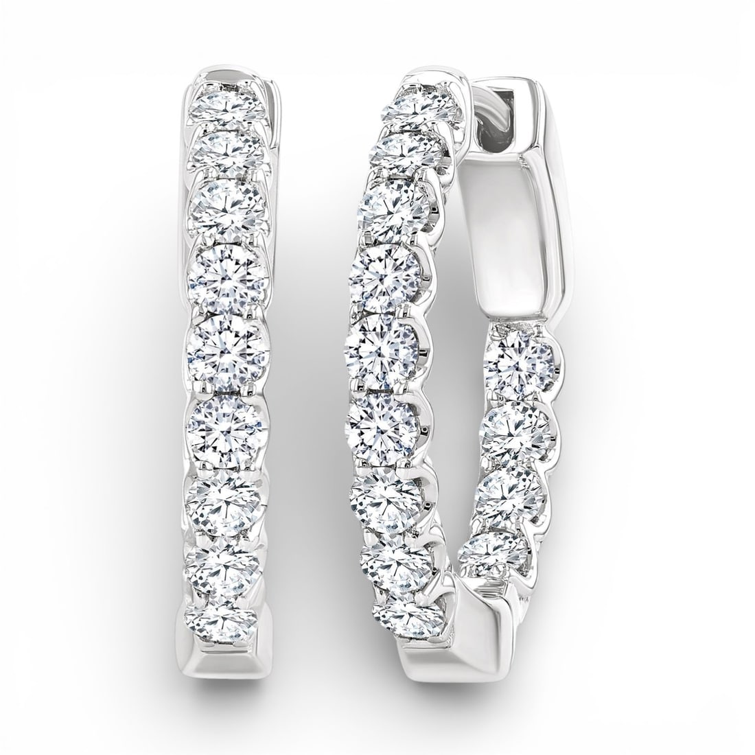 1.03 ctw White Diamond 14K White Gold Hoop Earrings: Exuding opulence and grace, this elegant Inside-Out pair of earrings featuring White Diamonds is crafted for the distinguished. A detailed Inside-Out Hoop gallery secures the stones, rendered in 4.85 