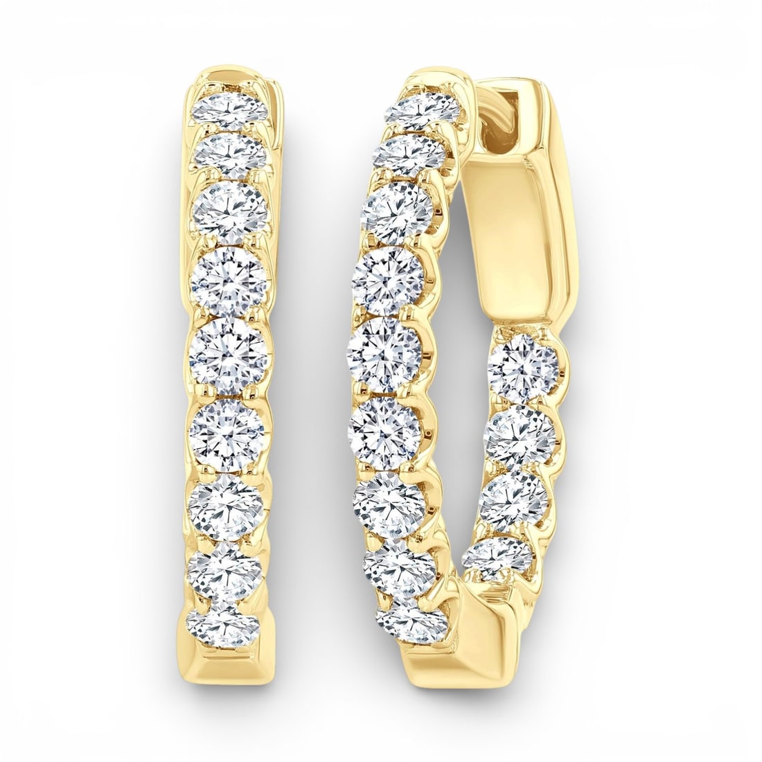 1.03 ctw White Diamond Inside-Out Hoop 14K Yellow Gold Earrings: Exuding opulence and grace, this breathtaking Inside-Out Hoop pair of earrings featuring White Diamond is crafted for the distinguished. Showcasing the gems in a Inside-Out Hoop arrangement, the earri
