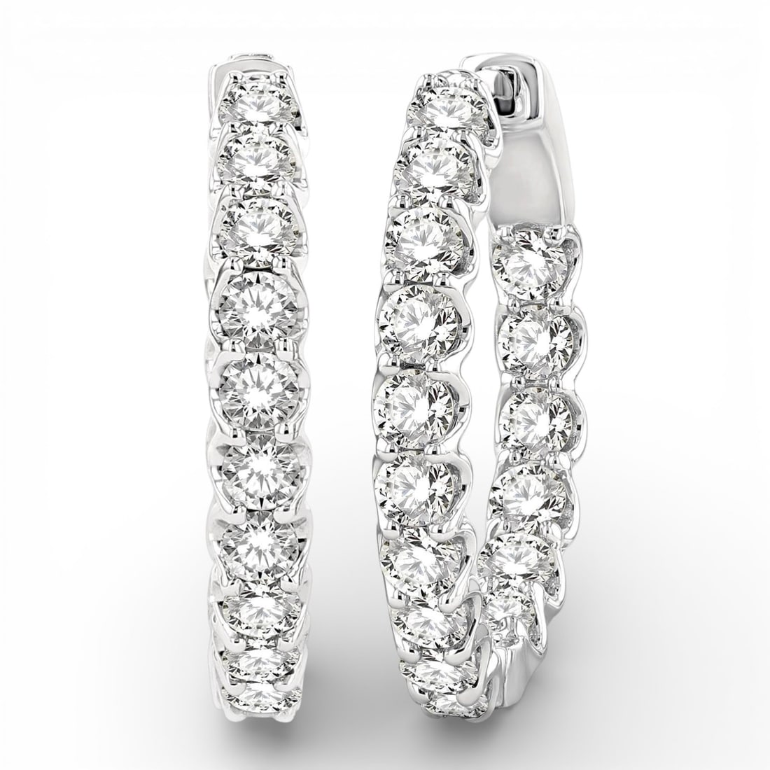 2.05 ctw Inside-Out White Diamond 14K White Gold Hoop Earrings: Captured in a moment of brilliance, this stunning Inside-Out Hoop pair of earrings featuring White Diamond speaks to the connoisseur. The gemstones are nestled within a Hoop framework, supported by a 