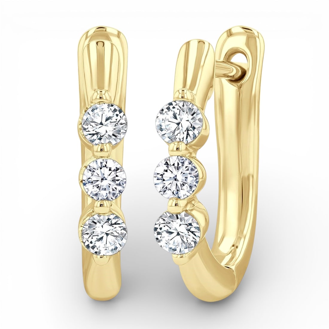 0.34 ctw Diamond Three-Stone 14K Yellow Gold Hoop Earrings: Defining modern elegance, this stunning Three-Stone pair of earrings featuring White Diamond captures the essence of style. Expertly mounted in a Three-Stone setting, the earrings are crafted in 2.35 