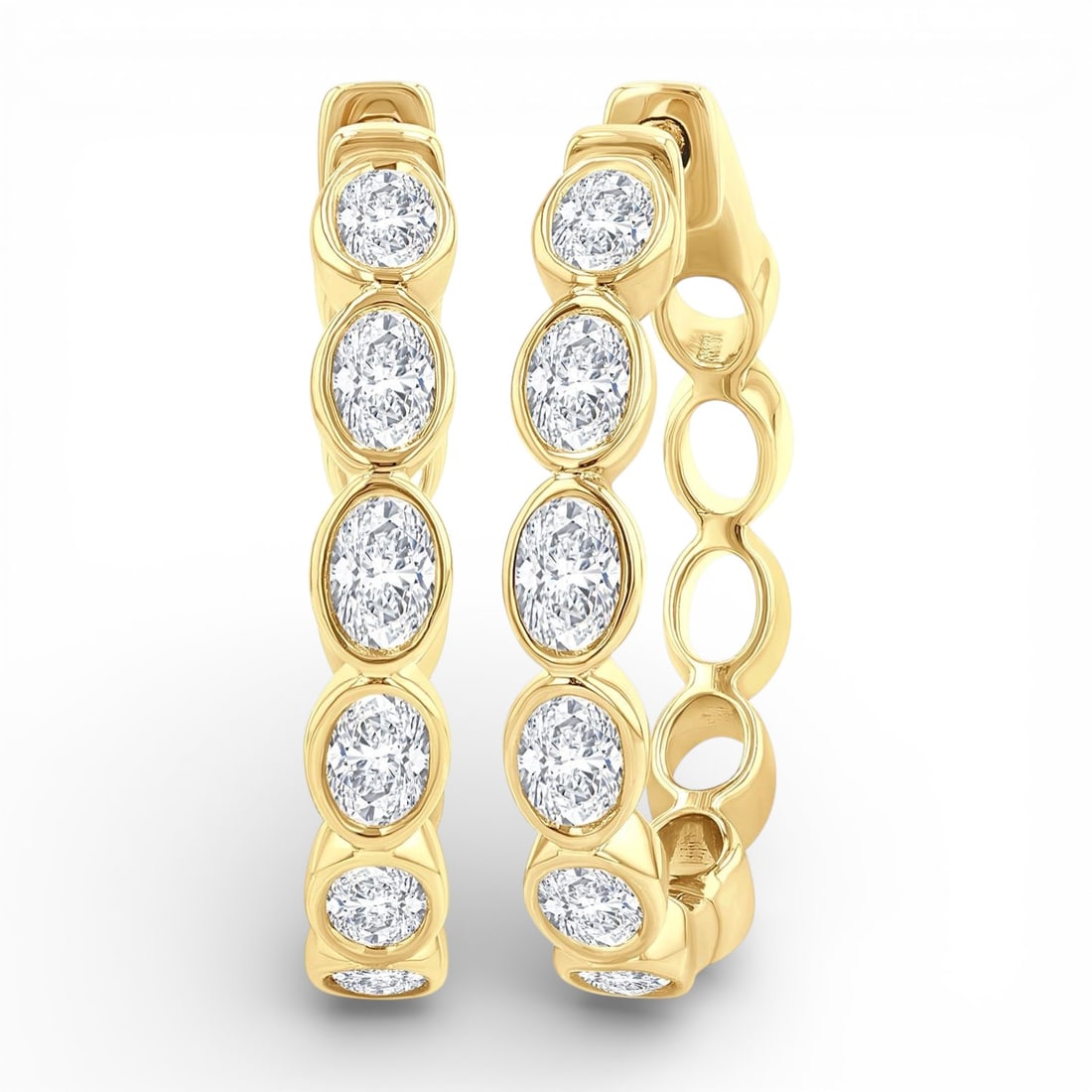 1.08 ctw Oval Diamond Bezel Set 14K Yellow Gold Hoop Earrings: Defining modern elegance, this stunning Bezel Set Hoop pair of earrings featuring White Diamond captures the essence of style. Securely held in a classic Bezel design, the earrings are forged from 5.7