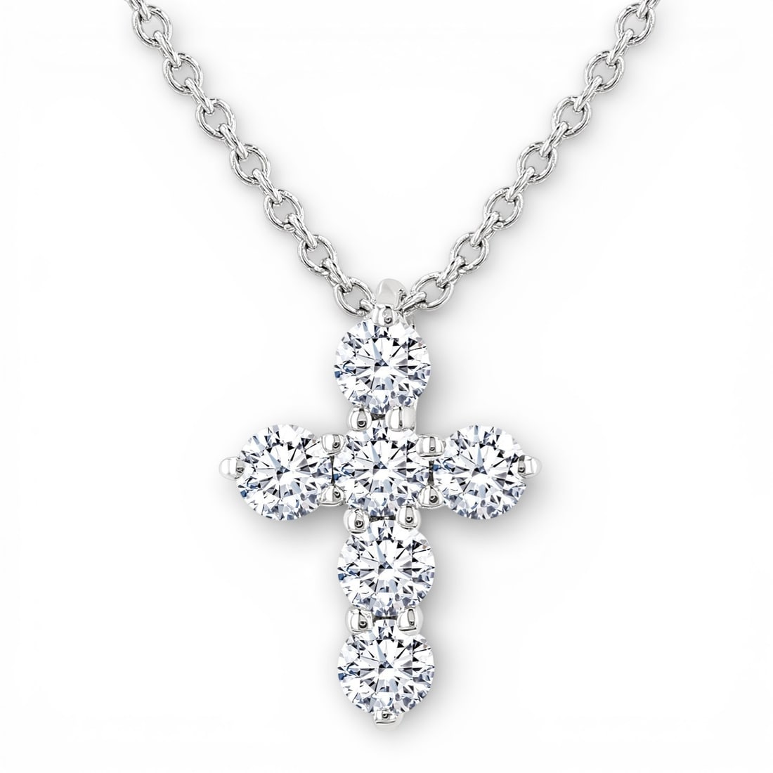 0.25 ctw Diamond Christian Cross 14K White Gold Pendant: Timeless and sophisticated, this elegant Christian Cross pendant featuring White Diamonds radiates enduring beauty. Securely held in a classic Cluster design, the pendant is forged from 0.25 grams of 