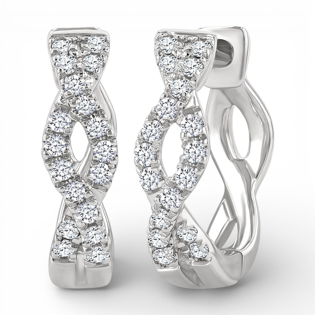 0.14 ctw Round White Diamond Entwined Huggie Earrings 10K White Gold: Rare and radiant, this elegant Entwined pair of earrings featuring White Diamond offers a touch of the extraordinary. Showcasing the gems in a Huggie Hoop arrangement, the earrings consists of 1.8 gra