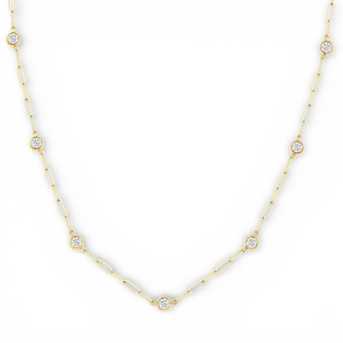 0.77 ctw Diamond Bezel Set Paperclip Station 14K Yellow Gold Necklace: Epitomizing grandeur, this exquisite Paperclip Station necklace featuring White Diamond stands as a beacon of refined taste. Showcasing the gems in a Station arrangement, the necklace consists of 3.15