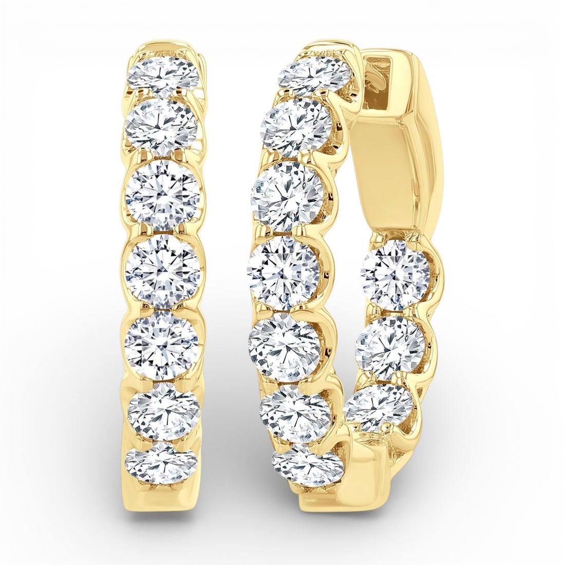 2.00 ctw Inside-Out Diamond 14K Yellow Gold Hoop Earrings: Defining modern elegance, this stunning Inside-Out Hoop pair of earrings featuring White Diamond captures the essence of style. The gemstones are nestled within a Shared Prong framework, supported by 