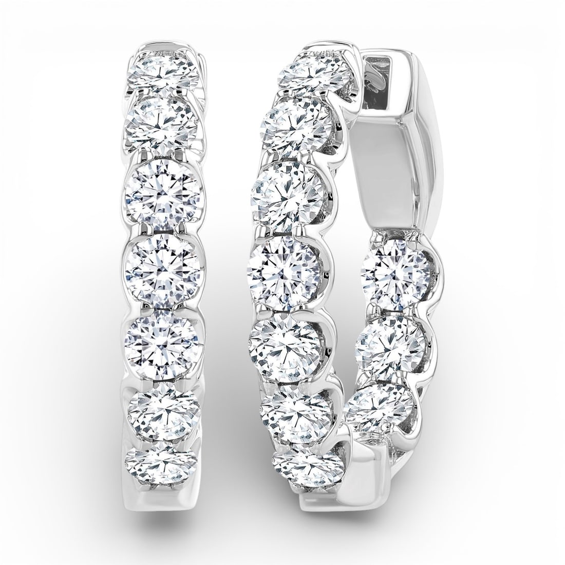2.0 ctw White Diamond Inside-Out Hoop Earrings 14K White Gold: Captured in a moment of brilliance, this exquisite Inside-Out Embellished pair of earrings featuring White Diamond speaks to the connoisseur. Expertly mounted in a Hoop setting, the earrings are craft