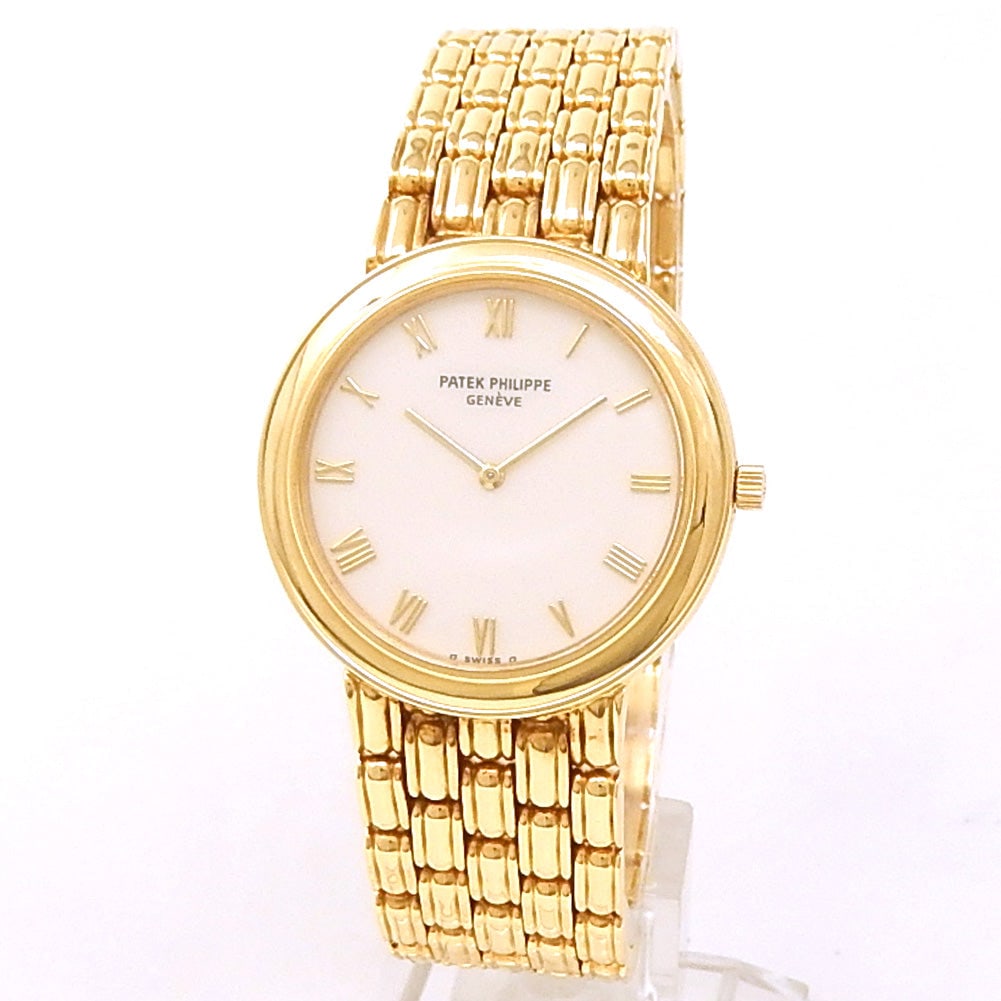 Patek Philippe Calatrava 3913/001 18k Yellow Gold Cream Dial: The Patek Philippe Calatrava, Reference 3913/001, stands as a supreme embodiment of dress watch sophistication. Crafted from radiant 18k yellow gold, this magnificent ladies' timepiece features a refi