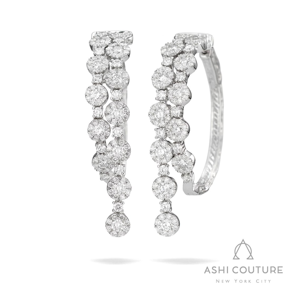 3.14 ctw Diamond Fiori Waterfall Hoop Cluster 18K White Gold Earrings: Defining modern elegance, this stunning Waterfall Hoop Cluster pair of earrings featuring White Diamond captures the essence of style. Expertly mounted in a Cluster setting, the earrings are crafted i