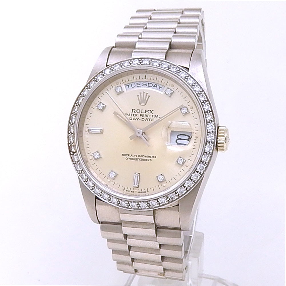 Rolex Day-Date 18349 18k White Gold Silver Diamond Dial: The Rolex Day-Date, Reference 18349, is the ultimate expression of prestige and horological excellence. Meticulously crafted in 18k white gold, this L-serial timepiece features a sophisticated silver 