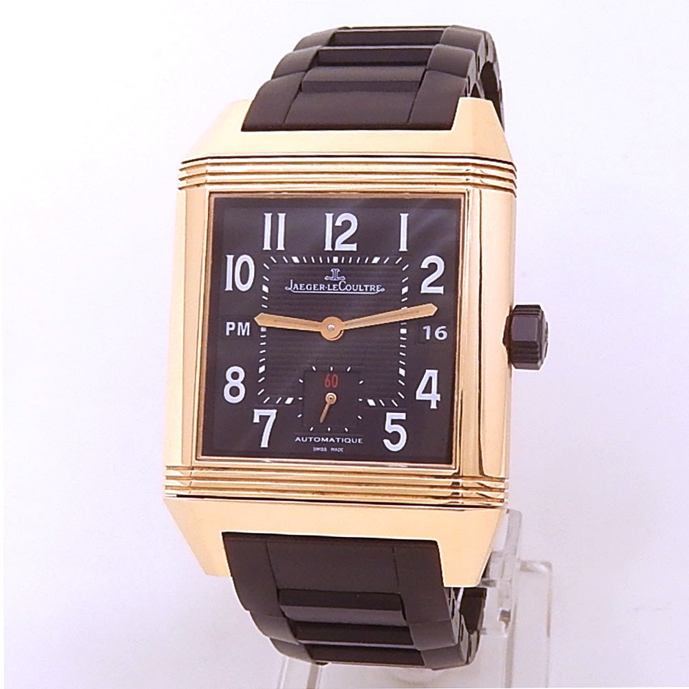 Jaeger-LeCoultre Reverso Squadra Hometime Q7002671 18k Rose Gold Black Dial: The Jaeger-LeCoultre Reverso Squadra Hometime, Reference Q7002671, is a bold and contemporary evolution of the manufacturer's iconic reversible timepiece. Crafted in lustrous 18k Rose Gold, this limit