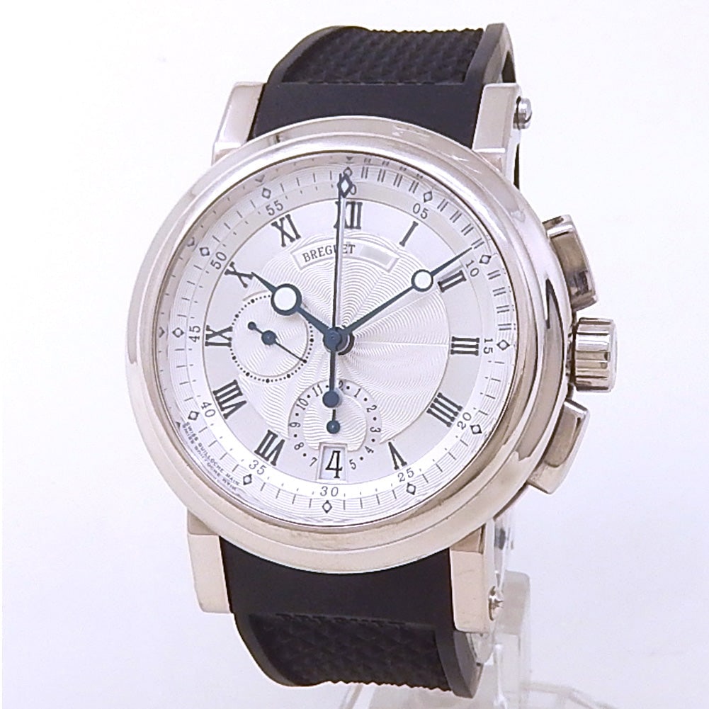 Breguet Marine Chronograph 5827BB/12/5ZU 18k White Gold Silver Dial: The Breguet Marine Chronograph, Reference 5827BB/12/5ZU, represents a perfect marriage of maritime heritage and haute horology. Crafted in prestigious 18k white gold, the refined 42mm case is defined 