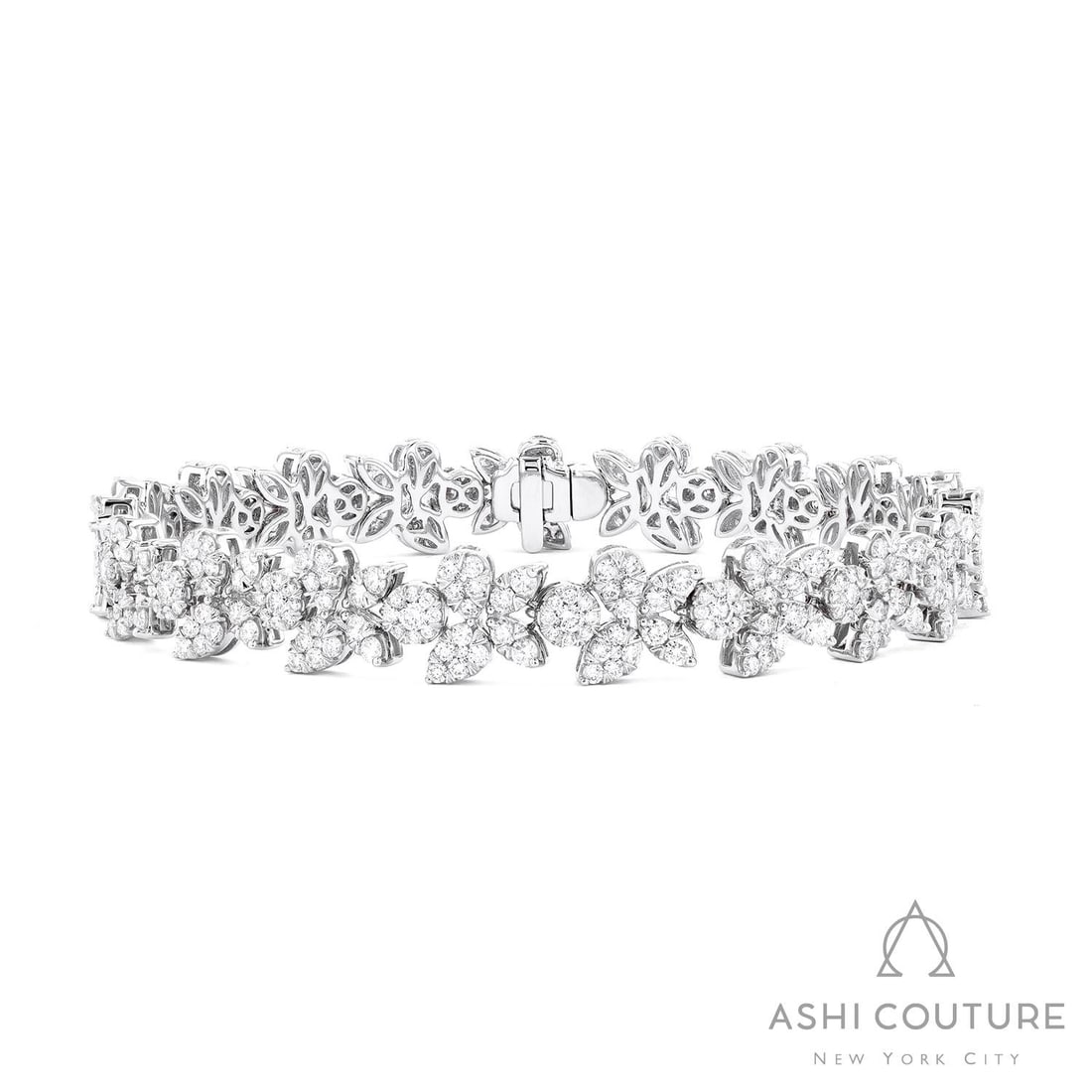4.77 ctw White Diamond Floral Cluster 18K White Gold Bracelet: A testament to superior craftsmanship, this exquisite Floral Cluster bracelet featuring White Diamond is unparalleled. A detailed Cluster gallery secures the stones, rendered in 18.35 grams of lustrou