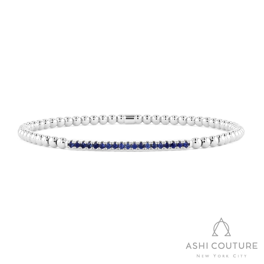 Sereno Blue Sapphire Bar Stretch 18K White Gold Bracelet: Timeless and sophisticated, this exquisite Bar Stretch bracelet featuring Blue Sapphire radiates enduring beauty. Expertly mounted in a Bar setting, the bracelet is crafted in 6.75 grams of solid 18K 
