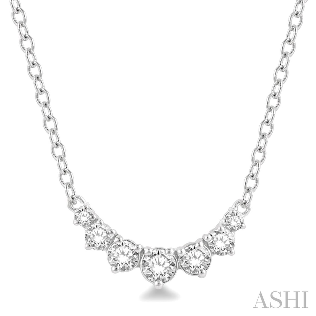 0.25 ctw Graduated Diamond Smile 14K White Gold Necklace: Defining modern elegance, this elegant Smile Necklace featuring White Diamond captures the essence of style. Securely held in a classic Cluster design, the necklace is forged from 0.9 grams of high-po