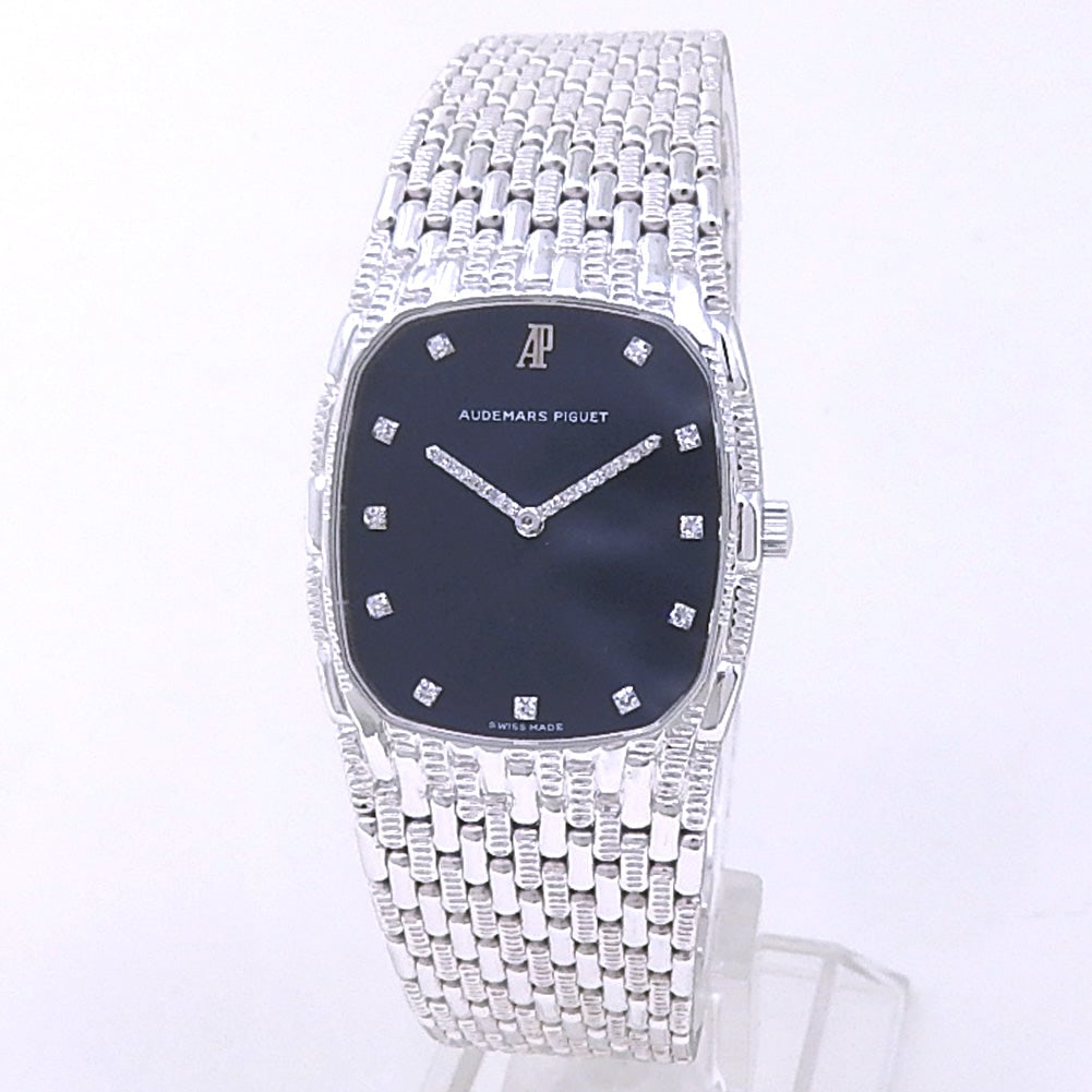 Audemars Piguet Cobra 18K White Gold Black Diamond Dial: The Audemars Piguet Cobra is a masterclass in vintage luxury and sculptural watchmaking design. Crafted in magnificent 18K white gold, this striking timepiece features a rich black dial adorned wi
