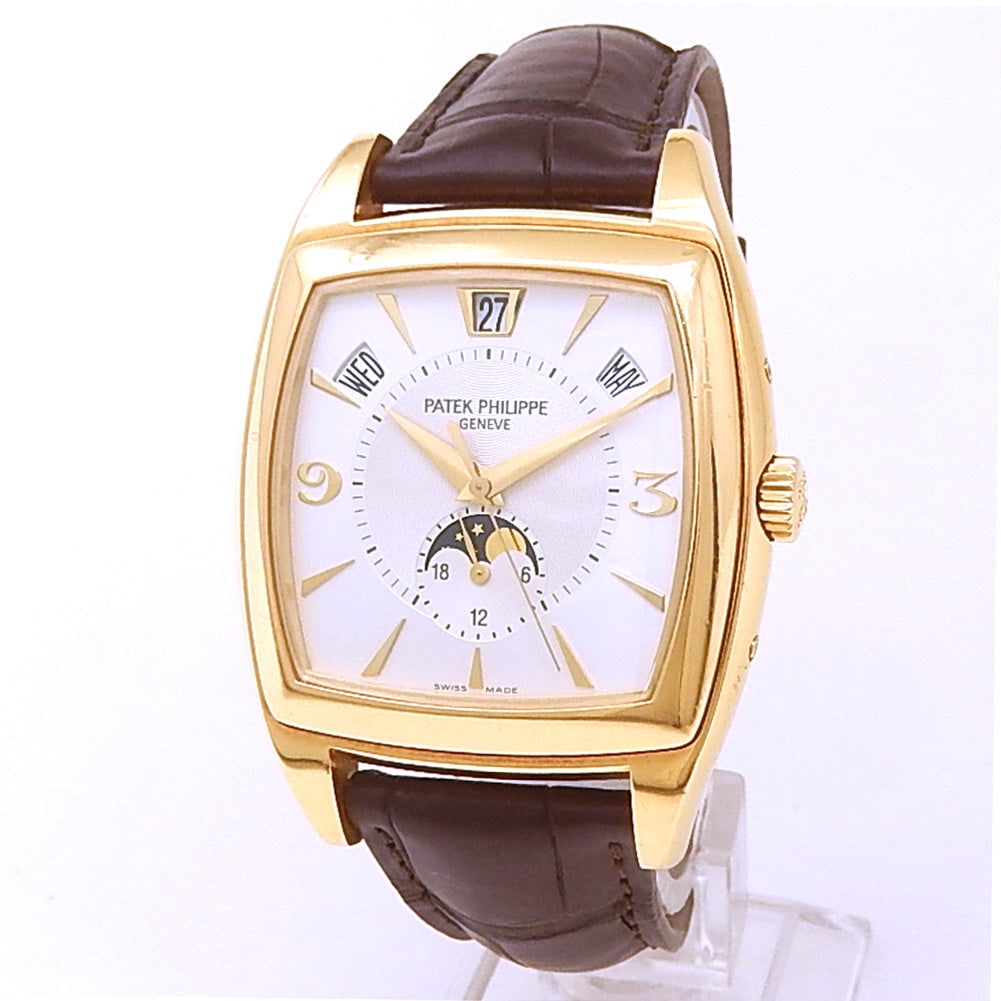 Patek Philippe Gondolo Ref. 5135J-001 18k Yellow Gold Silver Dial: The Patek Philippe Gondolo, Reference 5135J-001, is a compelling fusion of elegant form and haute horology. Encased in luxurious 18k yellow gold, this timepiece showcases a beautifully balanced silver