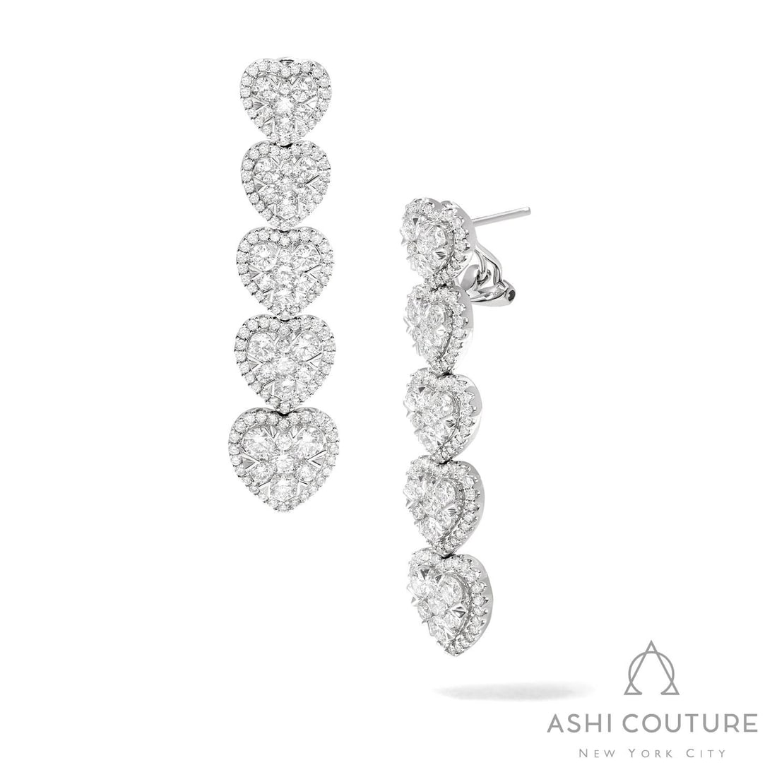 4.52 ctw Fiori Heart Cluster Diamond 18K White Gold Drop Earrings: A vision of luxury, this breathtaking Fiori Heart Graduating Drop Cluster pair of earrings featuring Natural Diamonds defines sophistication. Securely held in a classic Cluster design, the earrings ar