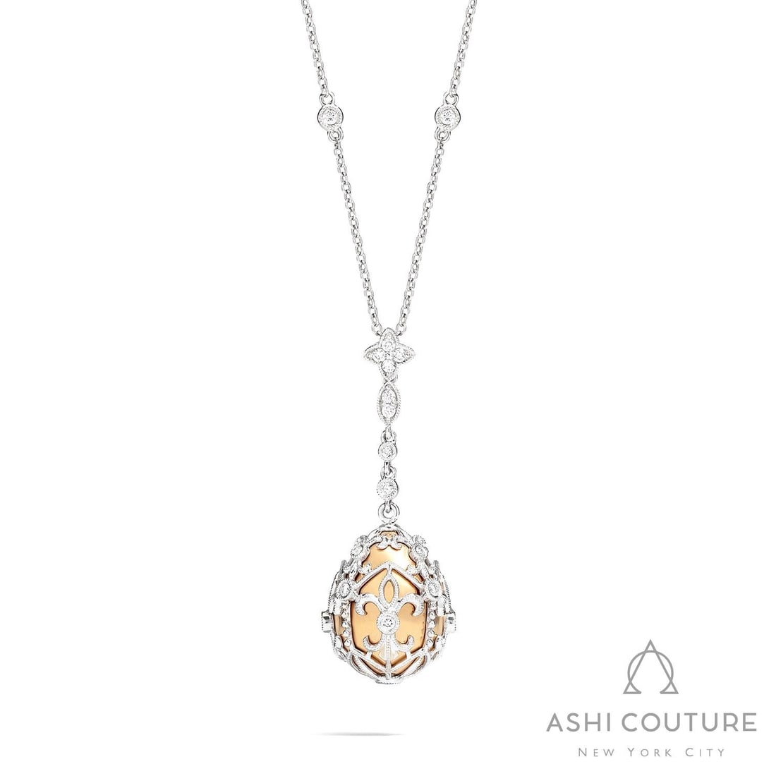 0.59 ctw Diamond 18K Yellow & White Gold Pendant: Captured in a moment of brilliance, this breathtaking Cage Drop necklace featuring Natural Diamonds speaks to the connoisseur. The gemstones are nestled within a Drop framework, supported by a substan