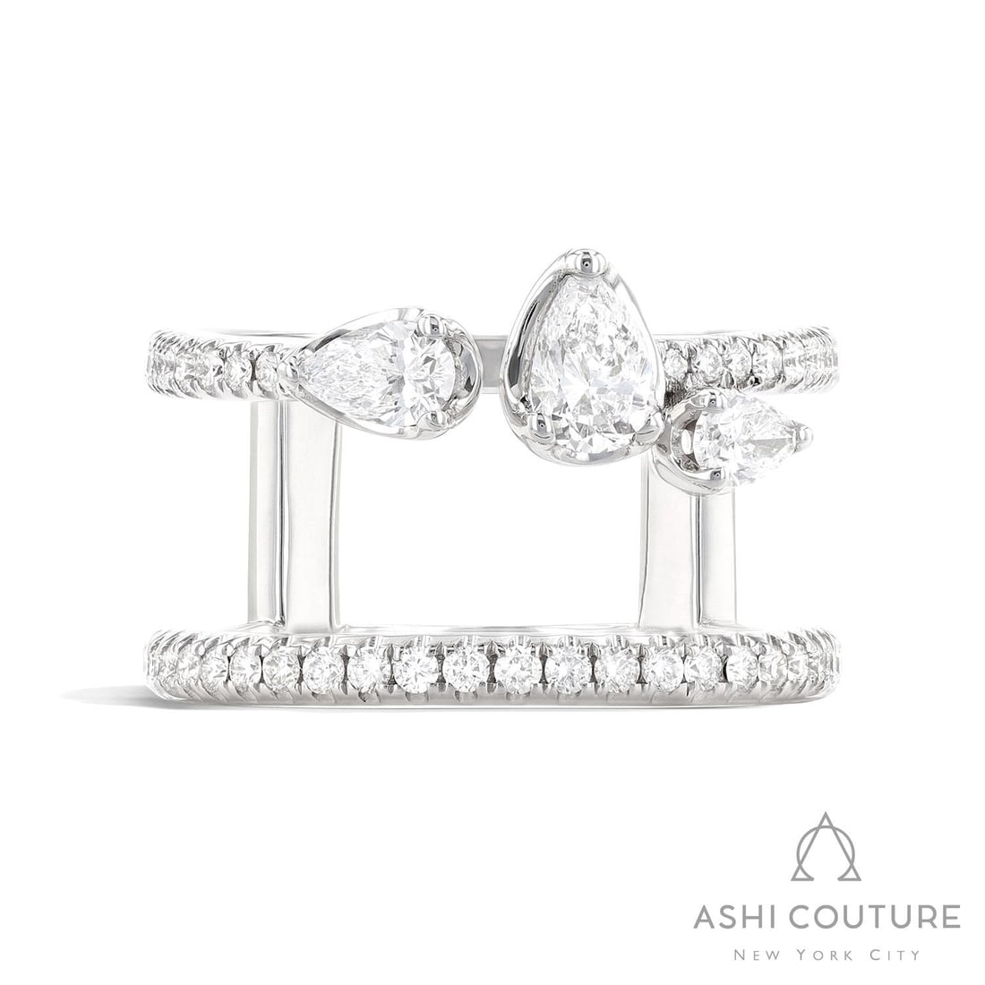 1.03 ctw Pear and Round Diamond Paradox Drift 18K White Gold Ring: Exuding opulence and grace, this breathtaking Paradox Drift ring featuring Natural Diamonds is crafted for the distinguished. A detailed Open Shank gallery secures the stones, rendered in 7.3 grams of