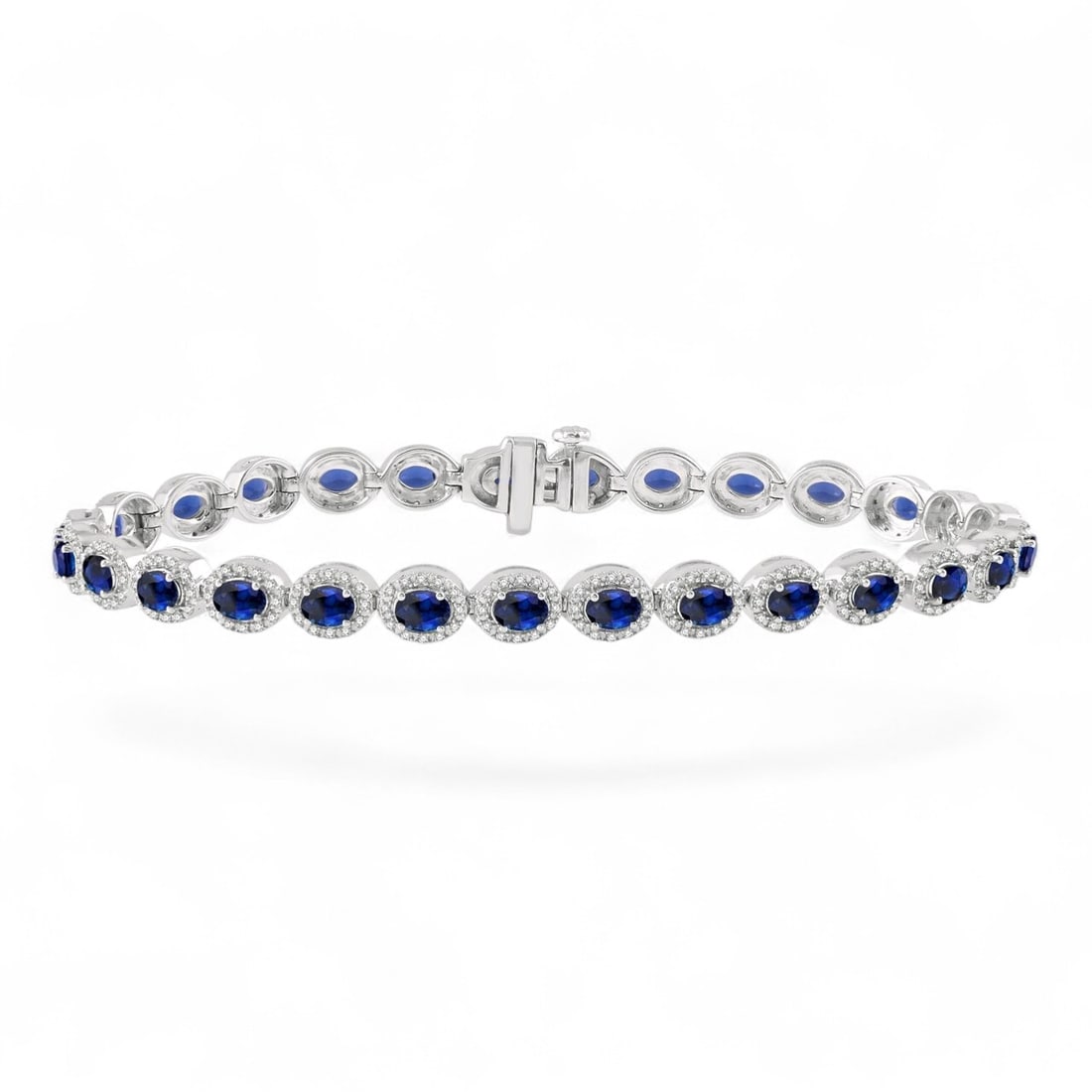 4x3 MM Blue Sapphire and 1.02 Ctw Halo White Diamond Modern 14K White Gold Bracelet - Certified: An exquisite masterpiece of haute joaillerie, this magnificent Halo bracelet featuring Natural Diamonds, and Sapphires is a true treasure. A detailed Halo gallery secures the stones, rendered in 13.0 