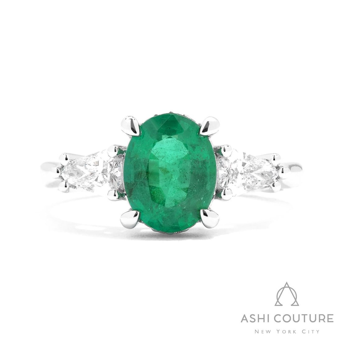 Oval Emerald, Diamond, and 0.59 ctw Diamond Accent Platinum Ring: Captured in a moment of brilliance, this stunning 3-Stone ring featuring Emerald, White Diamond speaks to the connoisseur. Expertly mounted in a Three-Stone setting, the ring is crafted in 5.85 grams 