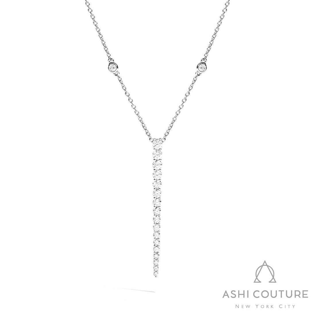 1.35 ctw Diamond 18K White Gold Pendant Necklace: Timeless and sophisticated, this breathtaking Graduating Necklace featuring Natural Diamonds radiates enduring beauty. Securely held in a classic Lariat design, the necklace is forged from 1.75 grams 