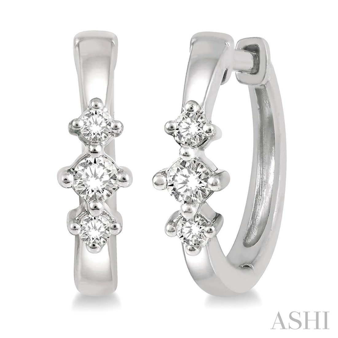 0.15 ctw Diamond Three Stone 10K White Gold Huggie Earrings: A symphony of light and color, this stunning Three Stone pair of earrings featuring White Diamond embodies the pinnacle of luxury. Securely held in a classic Three-Stone design, the earrings are forge