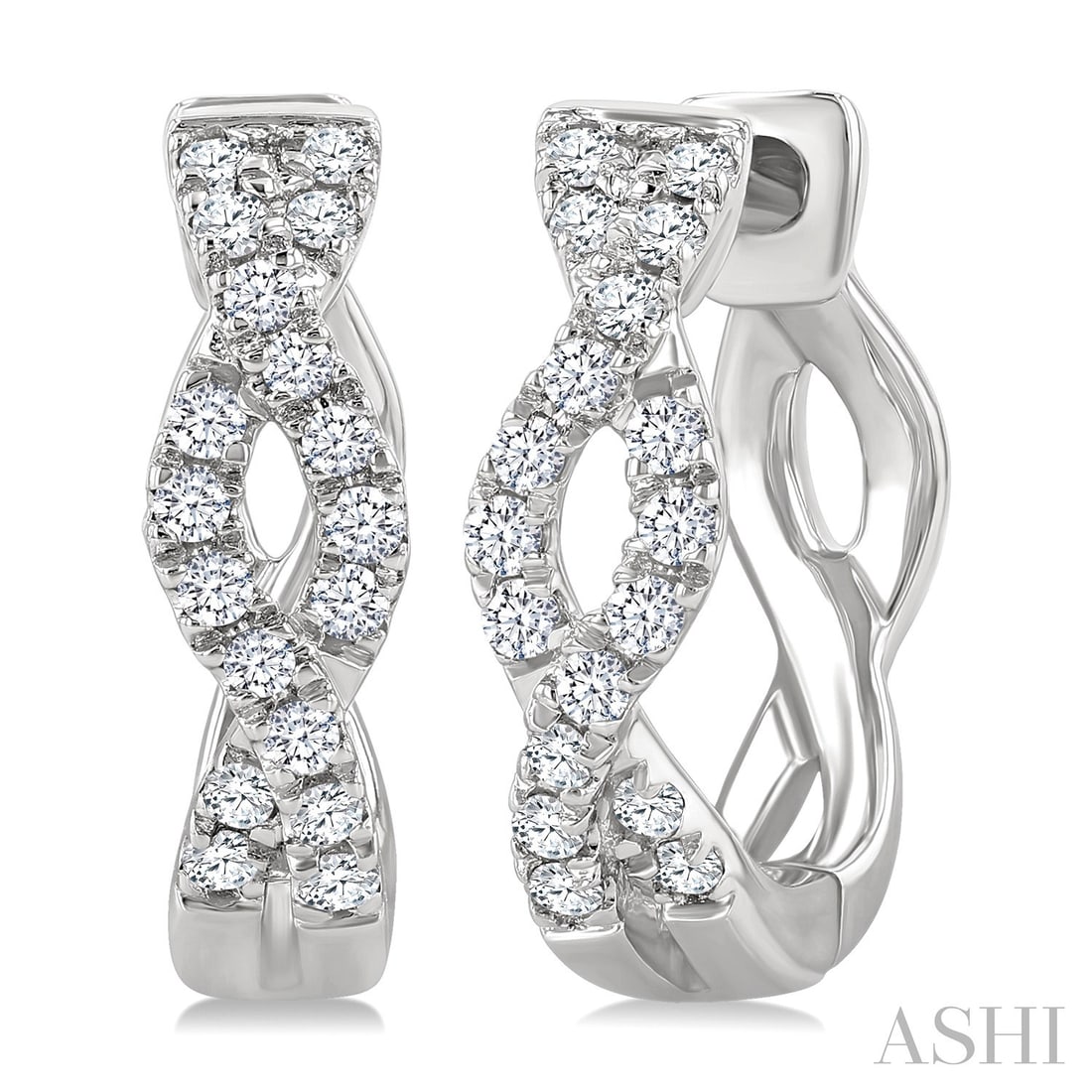 0.14 ctw Round White Diamond Entwined Huggie Earrings 10K White Gold: Rare and radiant, this elegant Entwined pair of earrings featuring White Diamond offers a touch of the extraordinary. Showcasing the gems in a Huggie Hoop arrangement, the earrings consists of 1.8 gra