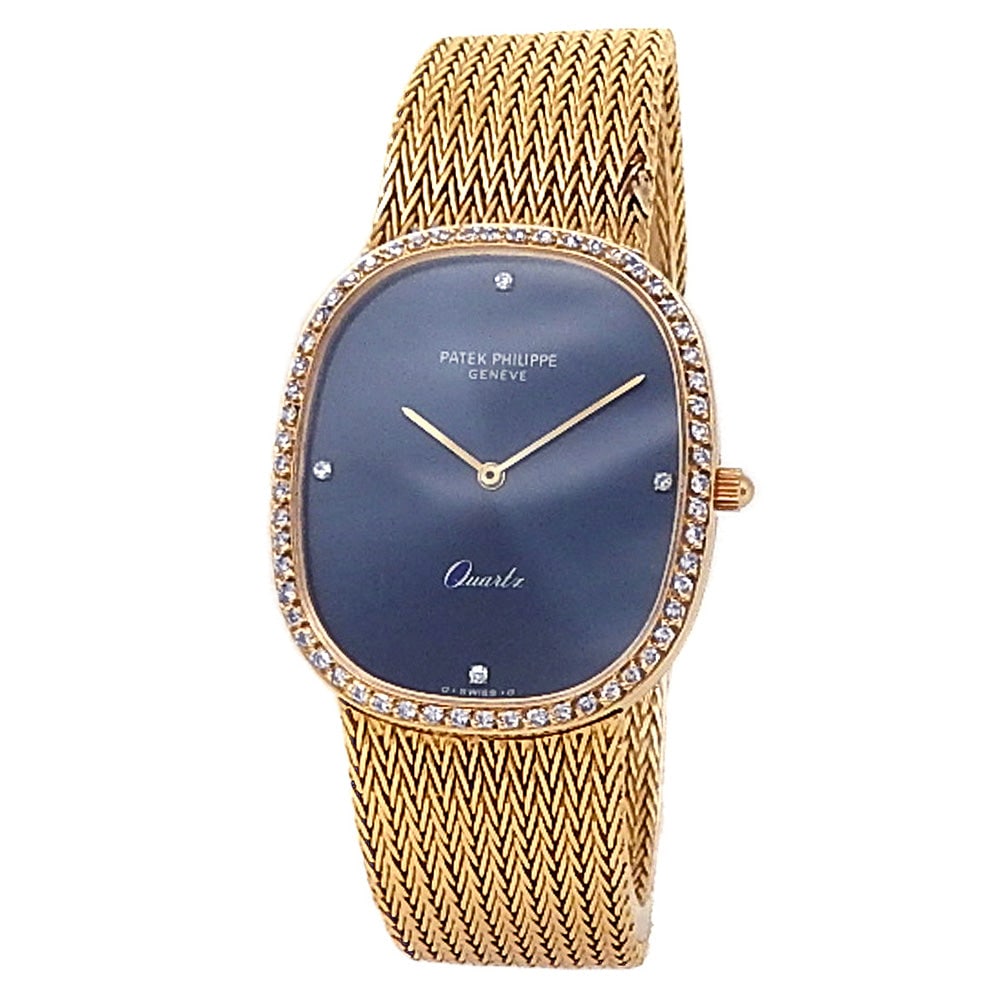 Patek Philippe Ellipse 3875/1J 18K Yellow Gold Blue Dial Ladies Watch: The Patek Philippe Ellipse, Reference 3875/1J, is an iconic testament to minimalist luxury and refined geometry. Beautifully crafted from radiant 18k yellow gold, this sophisticated ladies' timepiece 