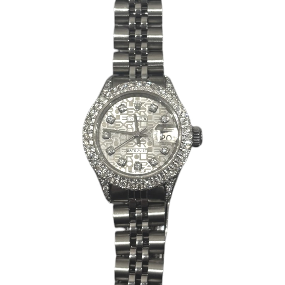 Rolex Date 6916 Stainless Steel 26mm Black Diamond Dial Fluted Bezel: The Rolex Date, Reference 6916, is a timeless expression of elegance. Crafted in robust stainless steel, this ladies' timepiece features a captivating Black Diamond dial, where the rich, dark back