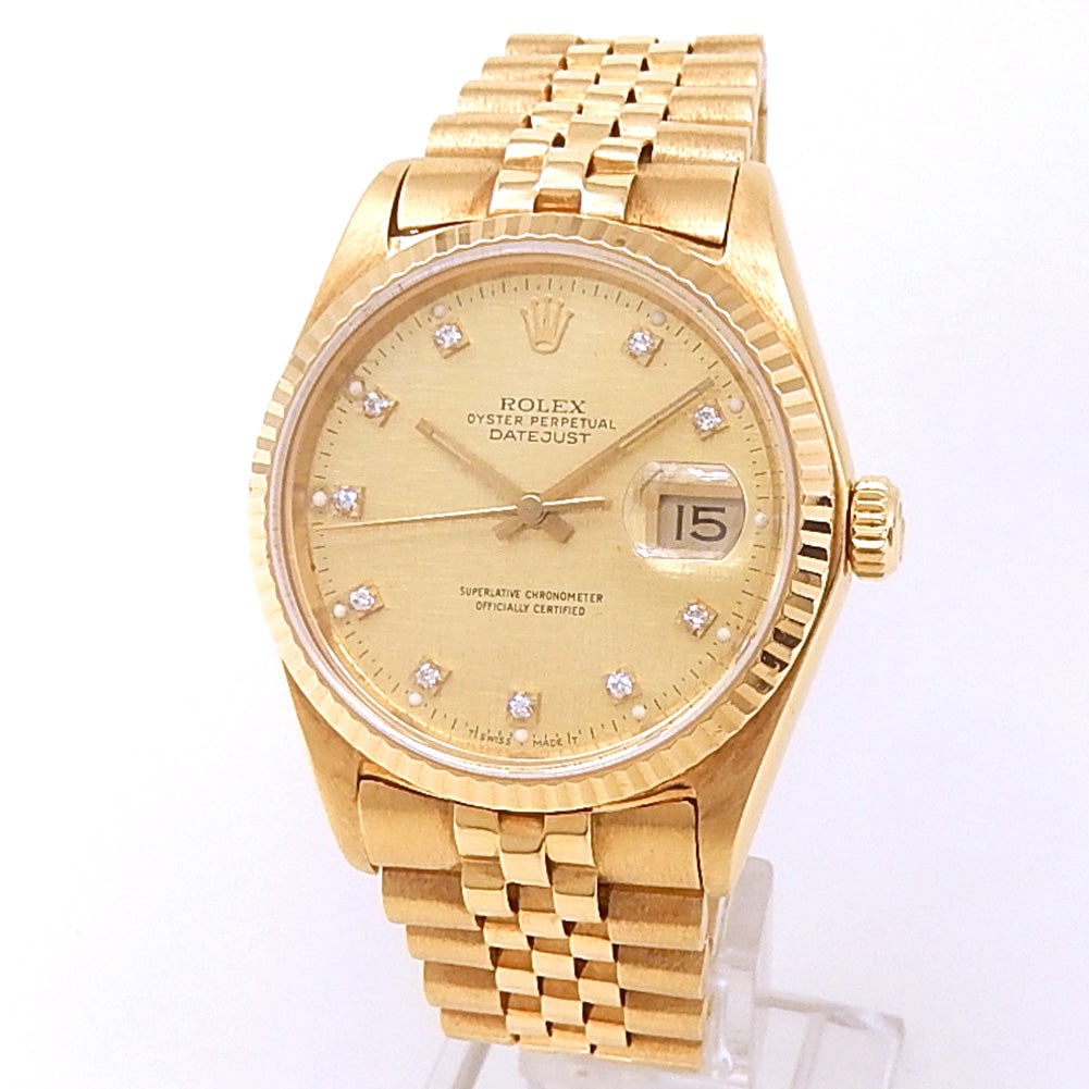 Rolex Datejust 16018 18k Yellow Gold Champagne Diamond Dial: The Rolex Datejust, Reference 16018, is a classic expression of timeless elegance. Crafted entirely in 18k yellow gold, this luxurious timepiece features a sophisticated champagne dial, elegantly