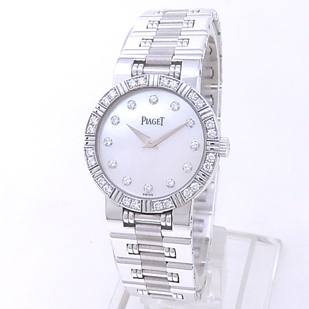 Piaget Mini Dancer P10215 18k White Gold Mother of Pearl Diamond Dial: The Piaget Mini Dancer, Reference P10215, represents the pinnacle of watchmaking elegance and jewelry mastery. Masterfully fashioned from lustrous 18k white gold, this compact ladies' timepiece featur