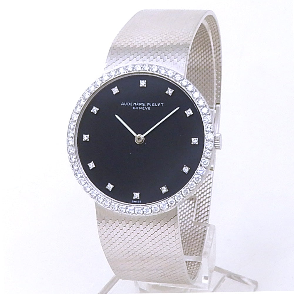 Audemars Piguet Vintage Ultra-Thin 18k White Gold Black Diamond Dial: The Audemars Piguet Vintage Ultra-Thin is a spectacular demonstration of luxury, refinement, and slim-profile watchmaking. Crafted in exquisite 18k white gold, the watch features an elegant case paire