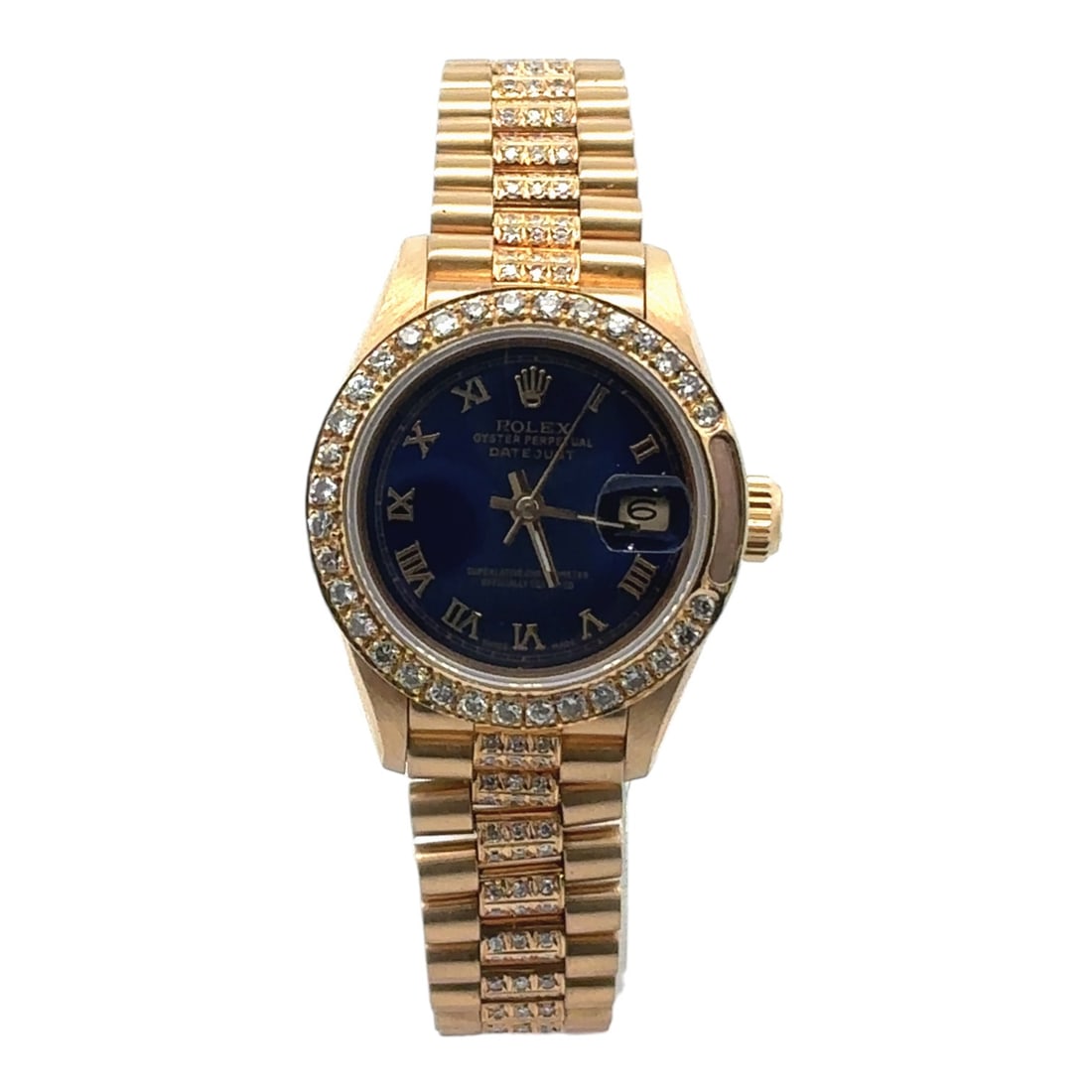 Rolex Datejust 69178 18K Gold Blue Dial Custom Diamond Bezel & Diamond Band Ladies Watch 26mm: The Rolex Datejust, Reference 69178, is a radiant expression of elegance. Crafted in 18K gold, this ladies' timepiece features a captivating blue Roman numeral dial, its classic configuration elev